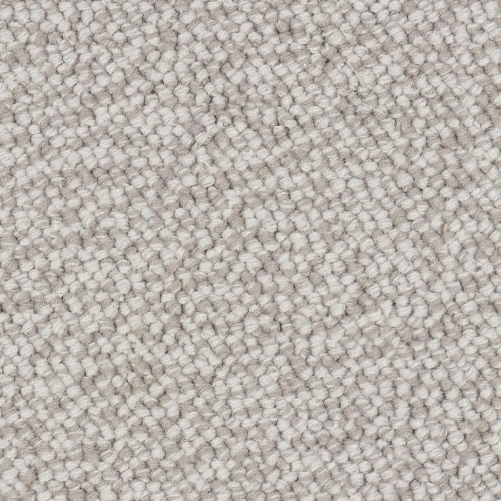Close-up of light beige textured carpet fibers
