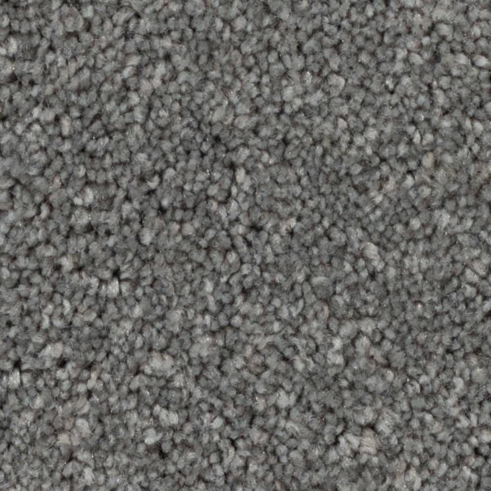 Close-up of gray textured carpet fibers