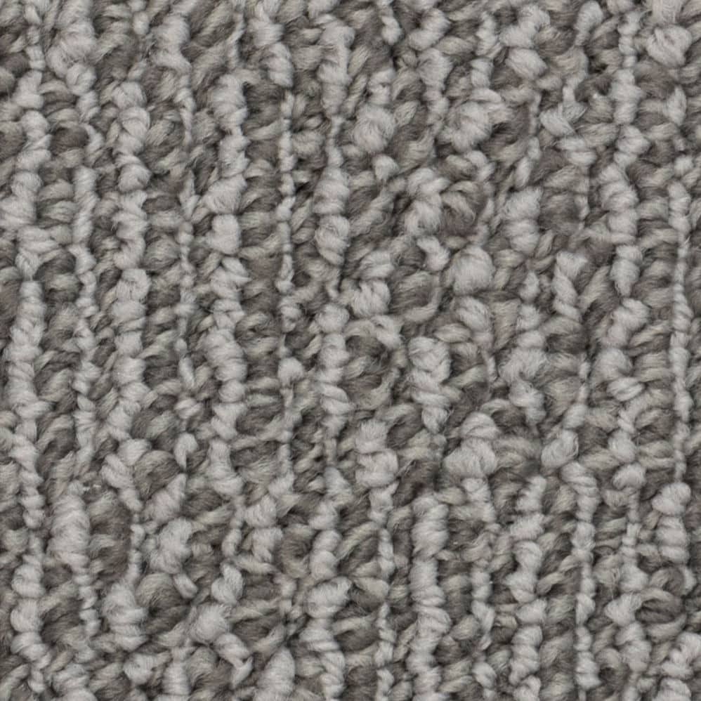 Close-up of gray textured carpet fibers