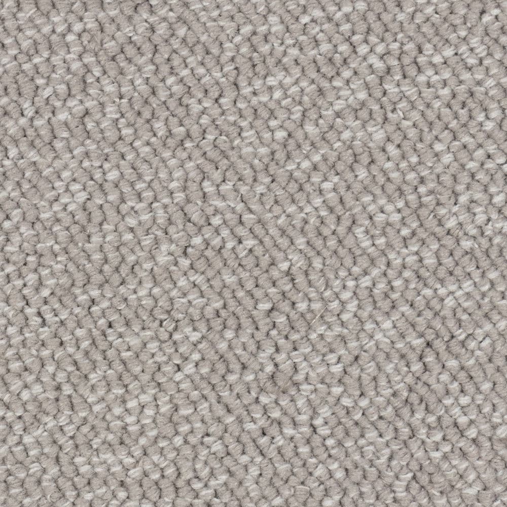 Close-up of beige textured carpet fibers