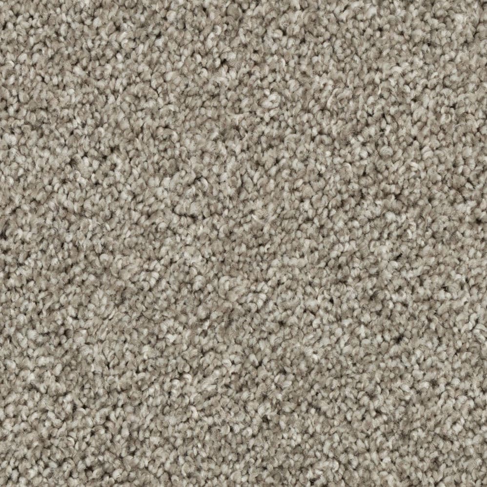 Close-up of beige textured carpet fibers