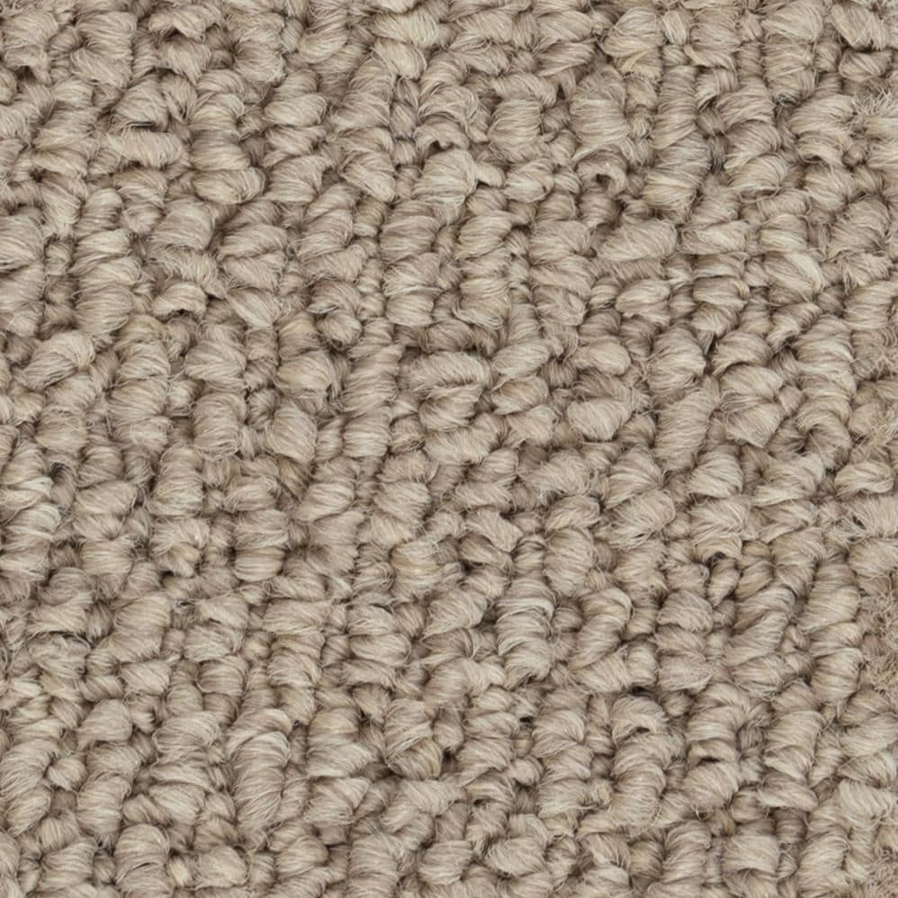 Close-up of beige textured carpet fibers