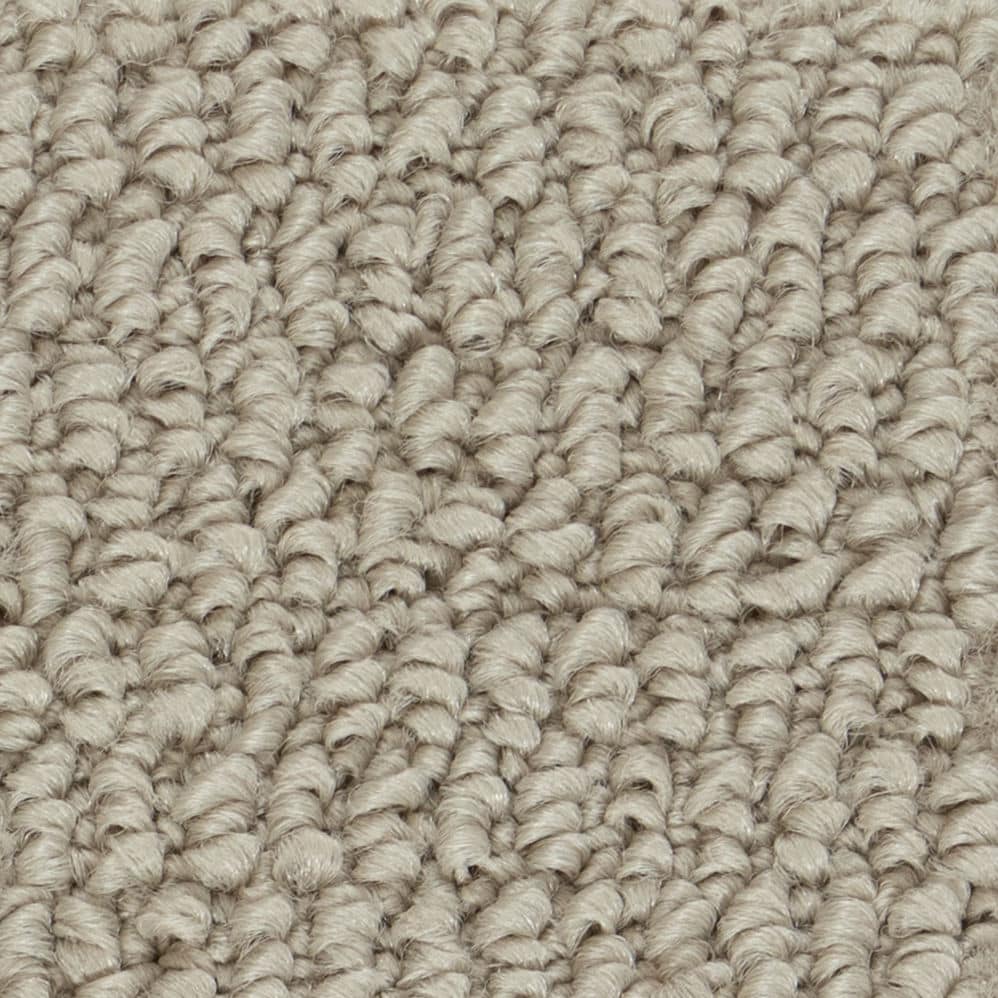 Close-up of beige loop pile carpet texture