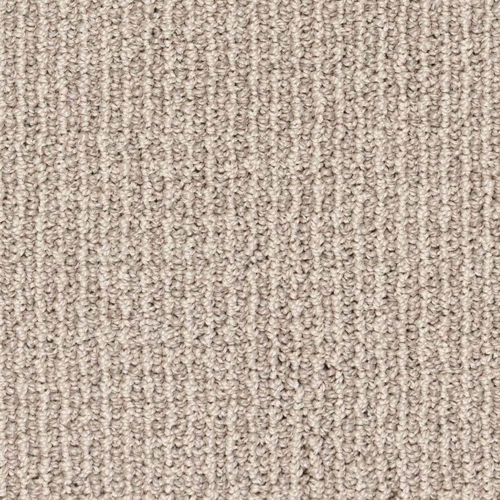 Close-up of beige textured carpet surface