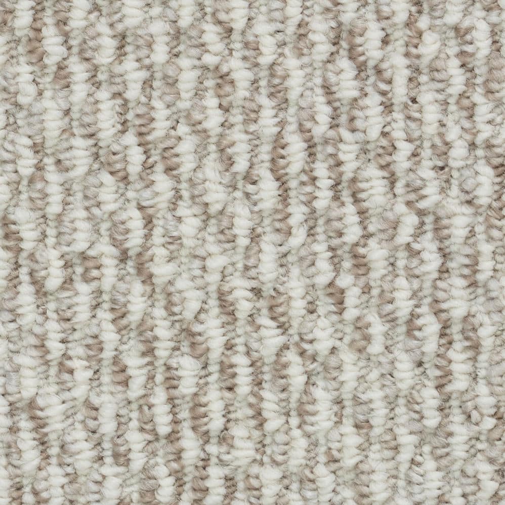 Close-up of beige and cream textured carpet