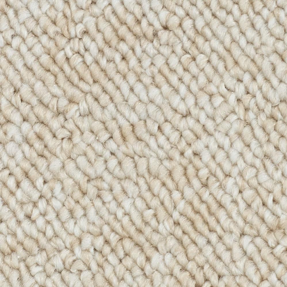 Close-up of beige textured carpet fibers