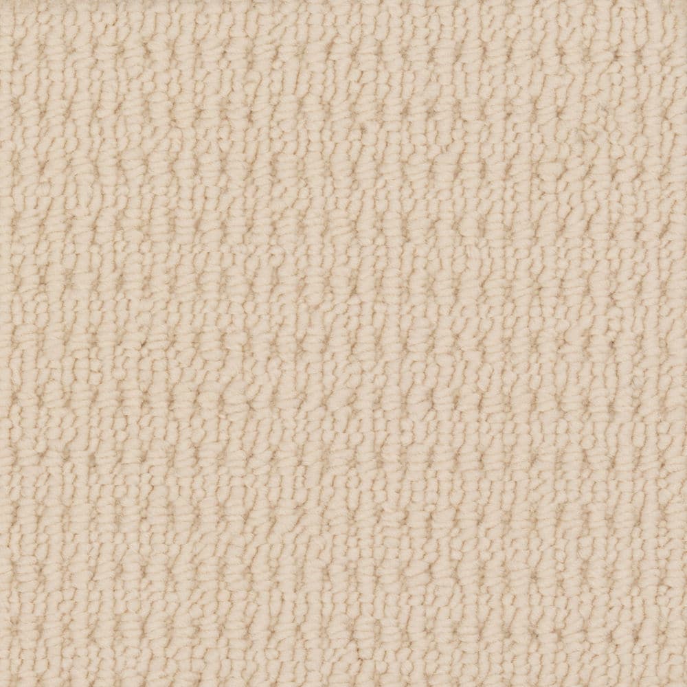 Close-up of beige textured carpet surface