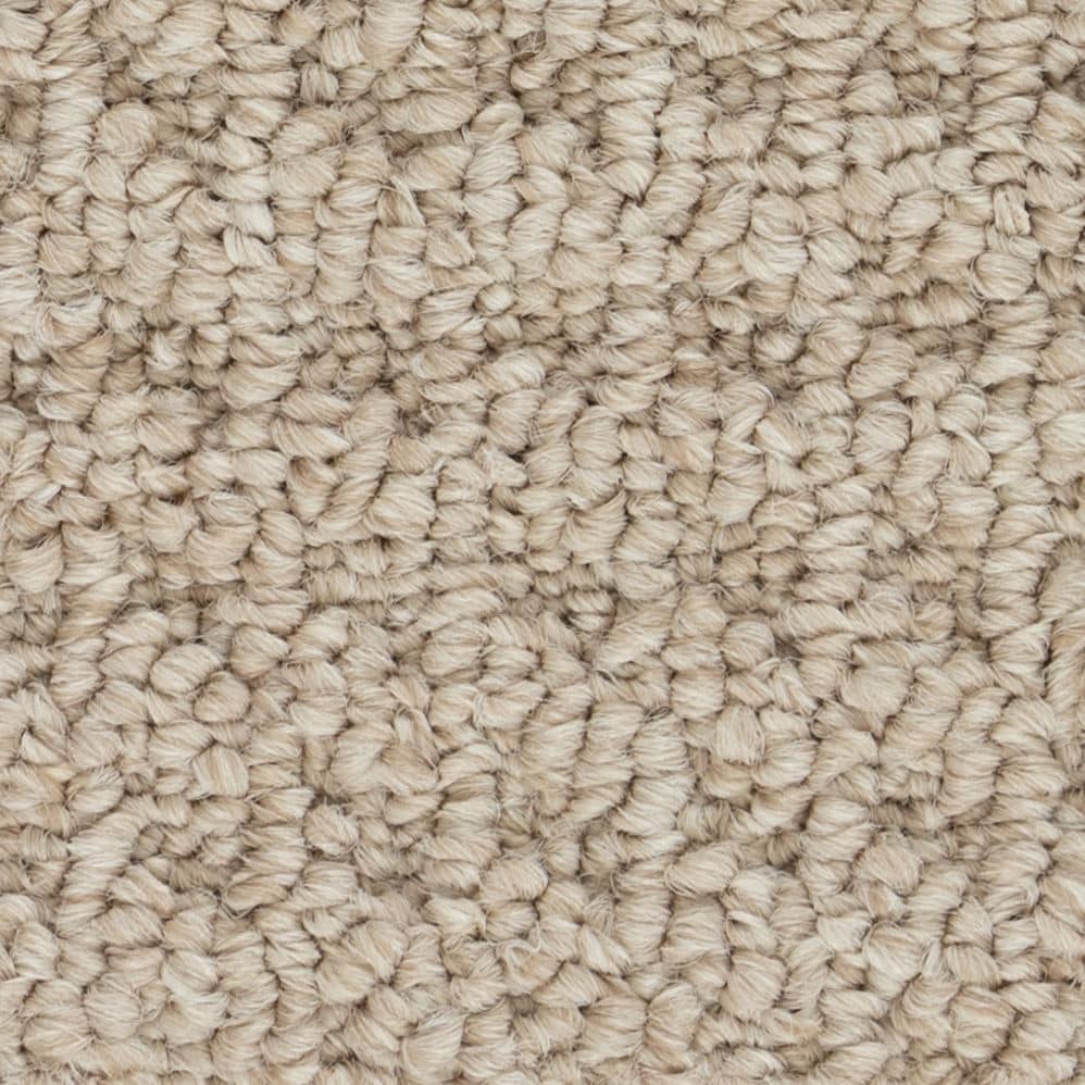 Close-up of beige textured carpet fibers