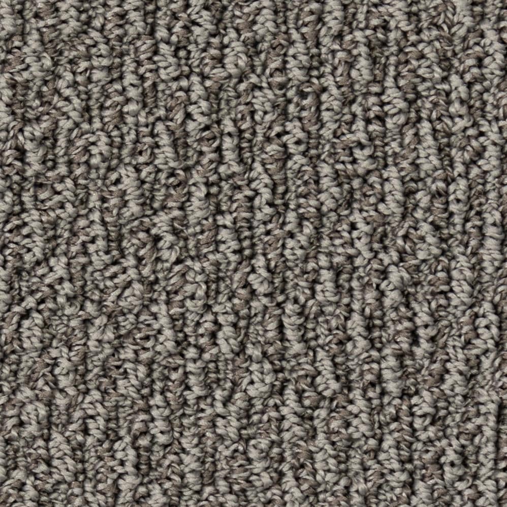 Close-up of gray textured carpet fibers