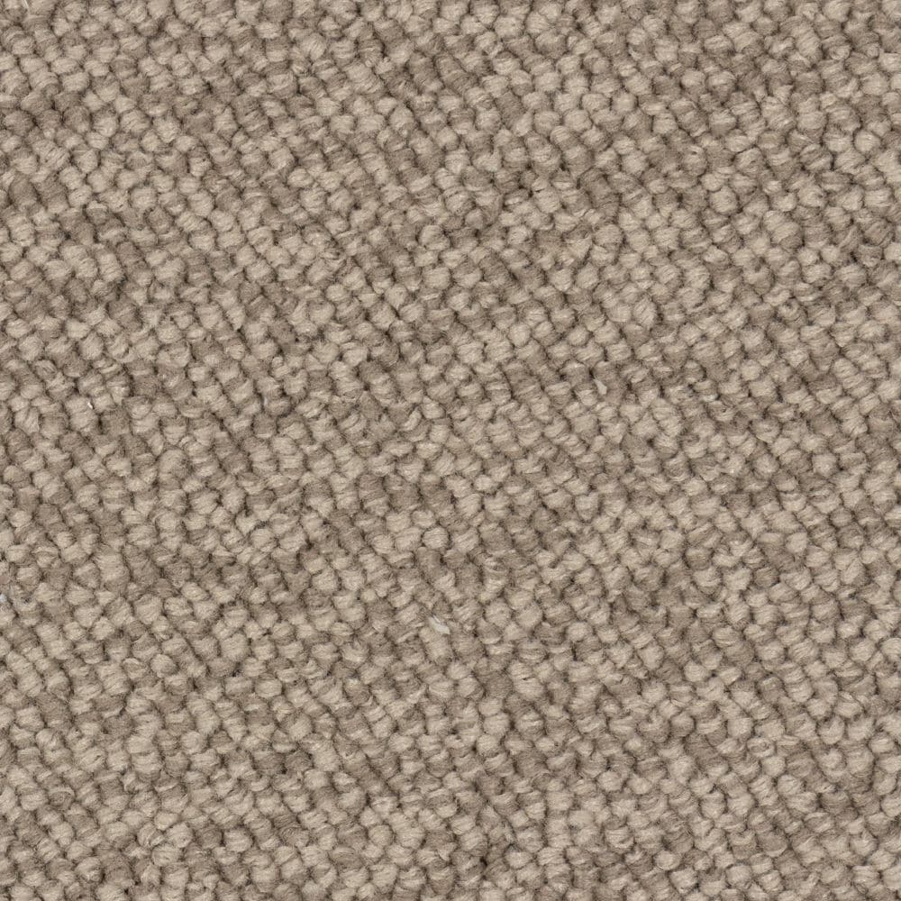 Close-up of beige textured carpet fibers