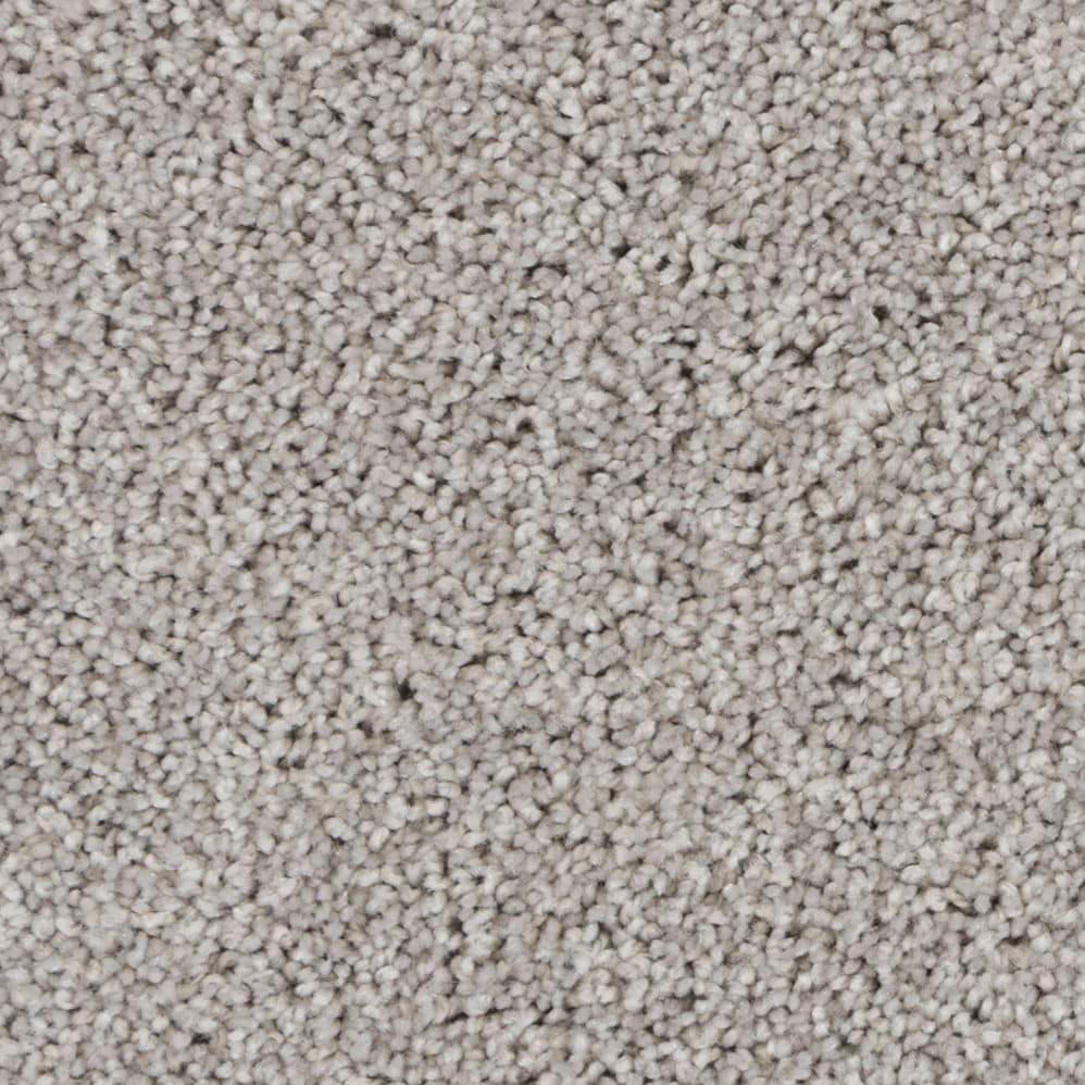 Close-up of light gray textured carpet fibers