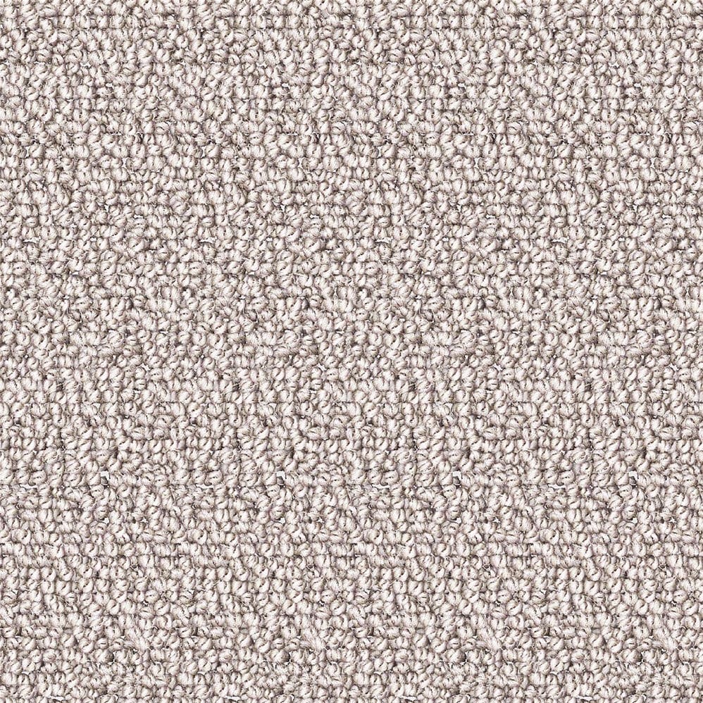 Close-up of beige loop pile carpet texture