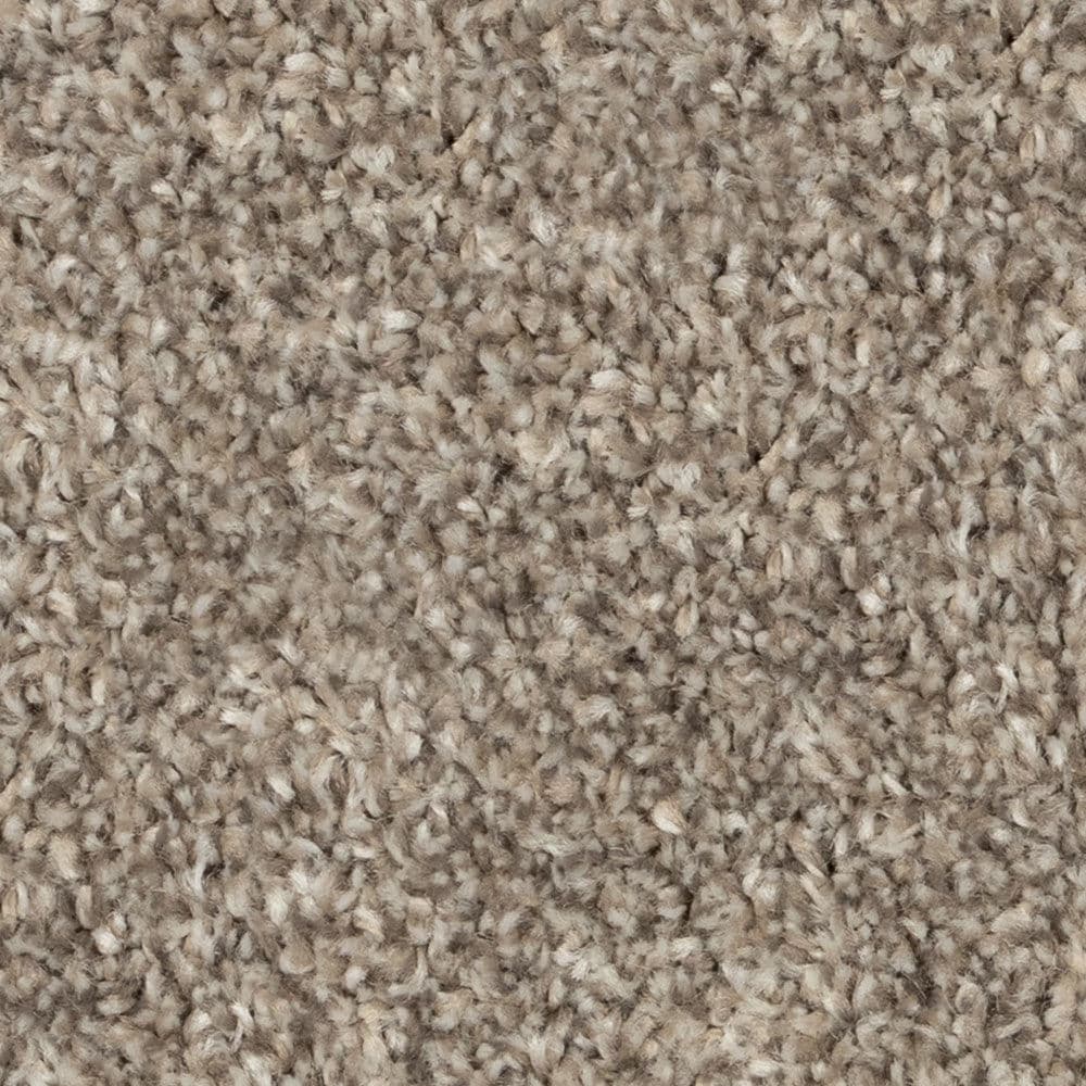 Close-up of beige textured carpet fibers
