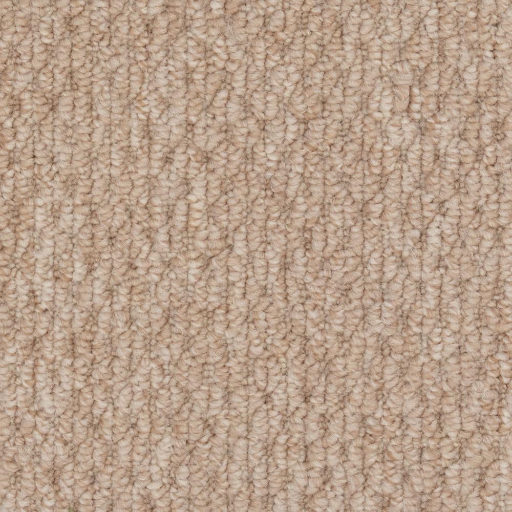 Close-up of beige textured carpet surface