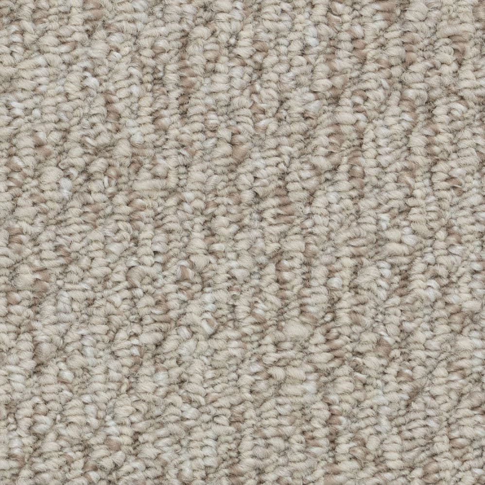 Close-up of beige textured carpet fibers