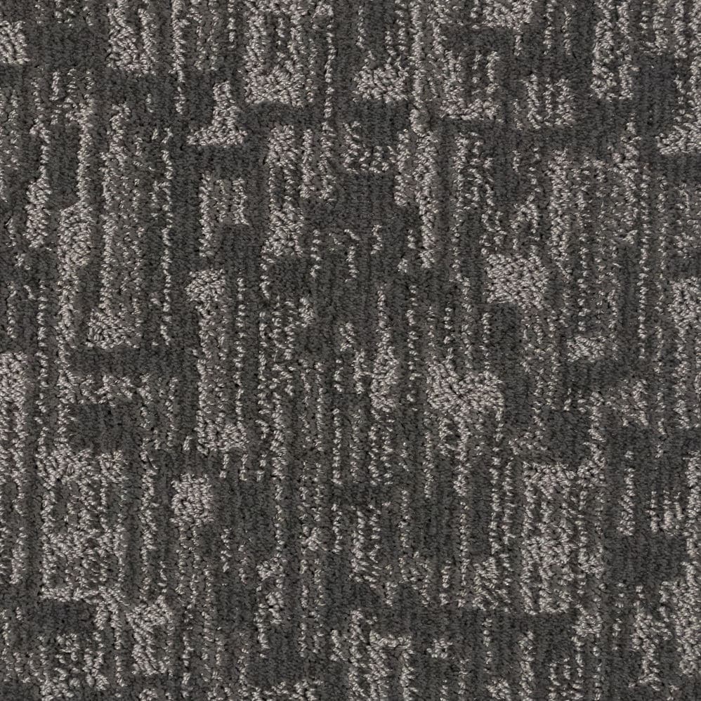 Gray textured carpet with abstract geometric pattern