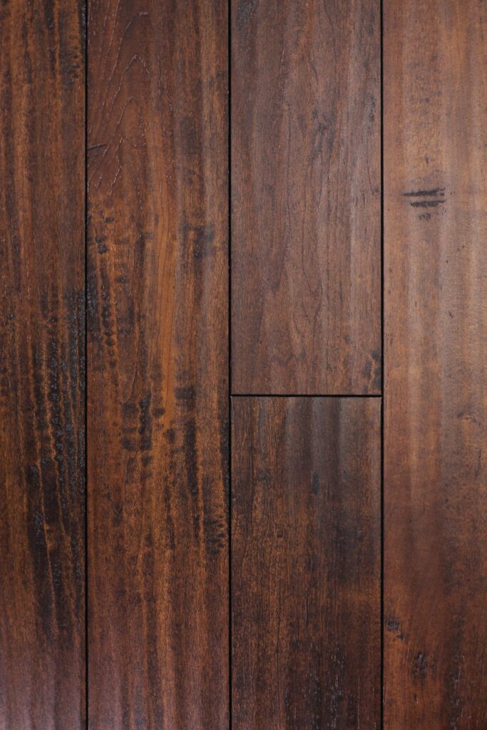 Dark brown wooden floor planks close-up texture