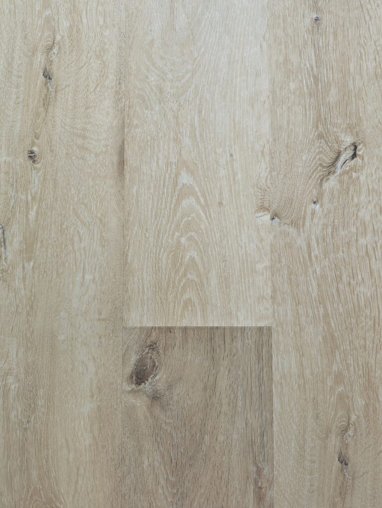 Light oak wood flooring with natural knots.