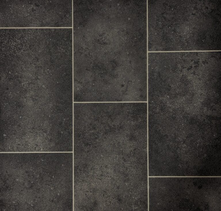 Dark textured floor tiles with light grout lines